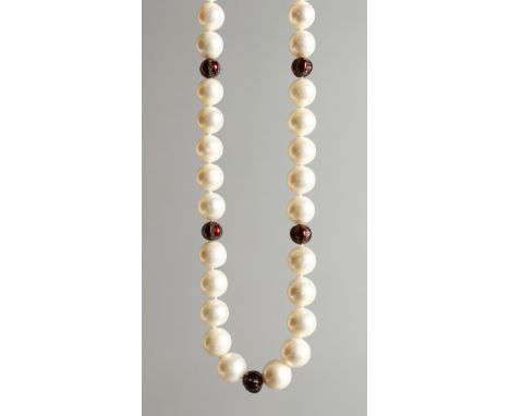 A STRING OF PEARLS WITH DIAMOND AND ENAMEL BEADS.