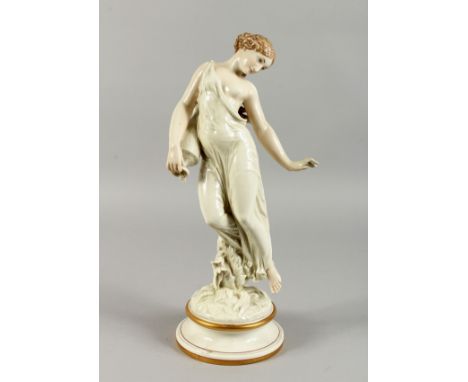 A ROYAL WORCESTER DANCING FIGURE OF A GIRL carrying a pitcher, on a circular base. 16ins high.
