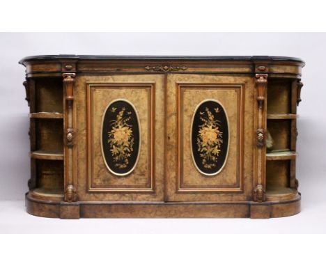 A GOOD VICTORIAN FIGURED WALNUT CREDENZA, with black marble top, the front fitted with a pair of oval marquetry panel doors w