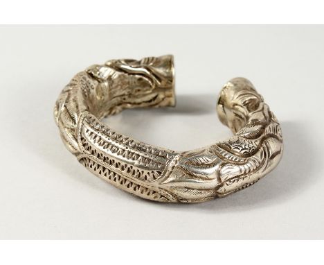 AN ISLAMIC SILVER METAL BANGLE.