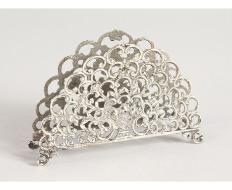 A PIERCED FAN SHAPED SILVER LETTER RACK.