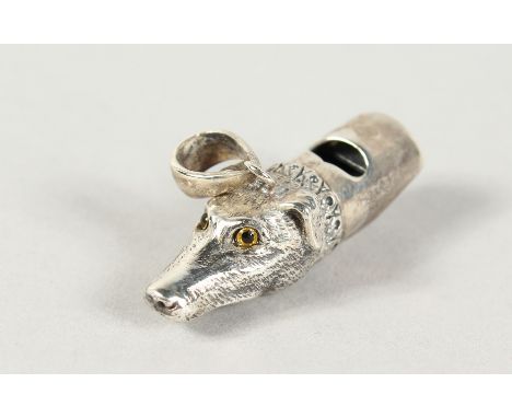 A CAST SILVER DOG WHISTLE.