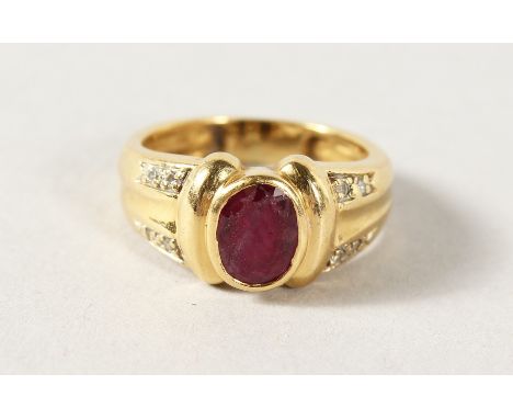 AN 18CT GOLD, RUBY AND DIAMOND RING.