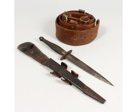 A WWII ISSUE FAIRBAIRN-SYKES COMMANDO DAGGER with chequered grip, plain oval disc guard stamped with broad arrow, B2, with or