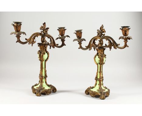 A GOOD PAIR OF 19TH CENTURY FRENCH ORMOLU AND GREEN PORCELAIN TWO-LIGHT CANDLESTICKS. 13ins high.