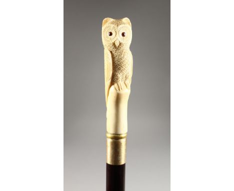 A CARVED BONE HANDLED WALKING STICK, OWL.