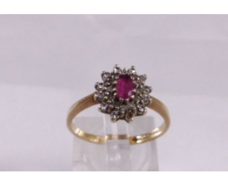 9CT RUBY DIAMOND RING. 9ct gold ring with central oval cut ruby surrounded by small diamonds, size P