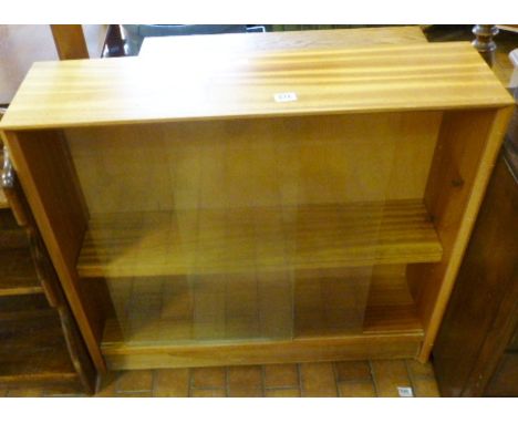 BOOKCASE. Two shelf wooden bookcase with sliding glass doors