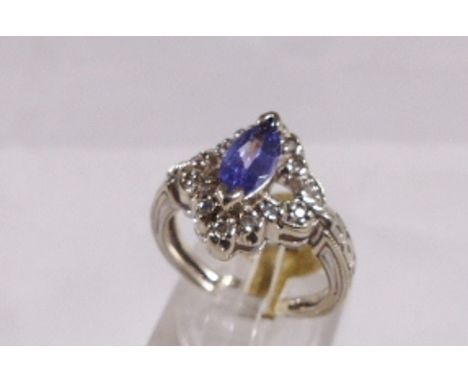 14CT DIAMOND TANZANITE RING. 14ct white gold diamond and marquise cut tanzanite 0,75ct ring, size K