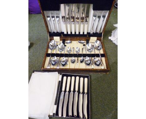 CANTEENS OF CUTLERY. Two vintage canteens of stainless steel cutlery including Viners, and some loose cutlery