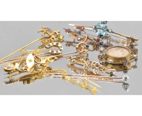 A group of 9ct gold and yellow metal stick pins and bar brooches, also a pendant, combined approx 14.4g.