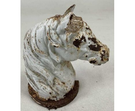 A cast iron horse head door stop, with white enamel paint, height 29cm. 