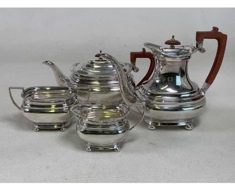 ROBERTS &amp; BELK; an Elizabeth II hallmarked silver four piece tea set, with stained wooden handle and finial to hot water 