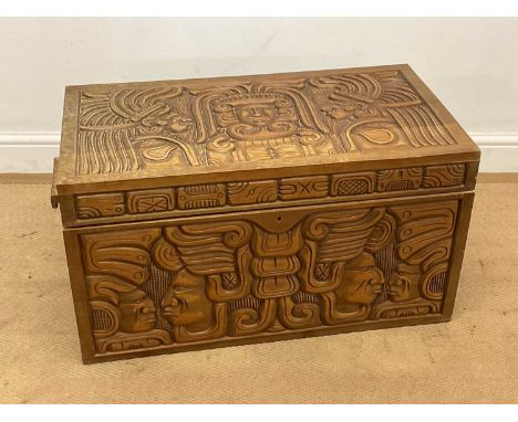 A South American Aztec style carved wooden trunk, height 42cm, width 77cm, depth 42cm.