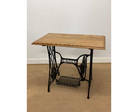 A Singer sewing table, height 76cm, width 88cm, depth 52cm.