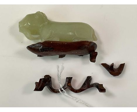 A 19th century Chinese carved mutton fat jade figure of a bearded goat, now mounted on a wooden stand, length 5.75cm.Provenan