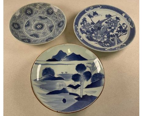 A 19th century Chinese charger, decorated with an exotic bird amongst foliage, painted character marks to the reverse, diamet