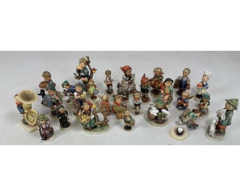 GOEBEL; a collection of twenty-seven Humnel figurines Condition Report: Some have issues with small chips and nibbles, one br