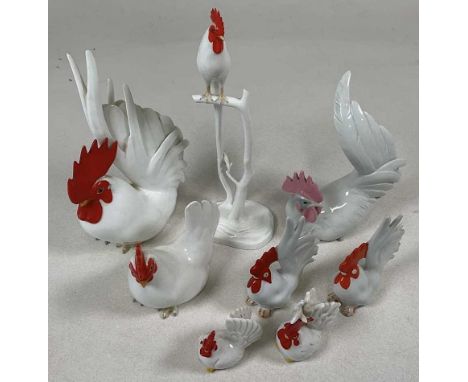 NORITAKE; three chicken ornaments, tallest 36 cm, together with five other chicken pieces including a salt and pepper.