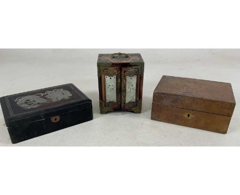 An early 20th century brass mounted Chinese miniature table cabinet, set with jade plaques to the doors and three internal dr