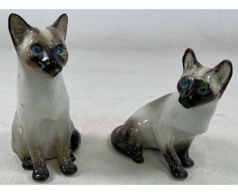 WINSTANLEY; two Siamese kittens, signed and marked no 3 to base, 23cm.Condition Report: Both are free from any chips, cracks 