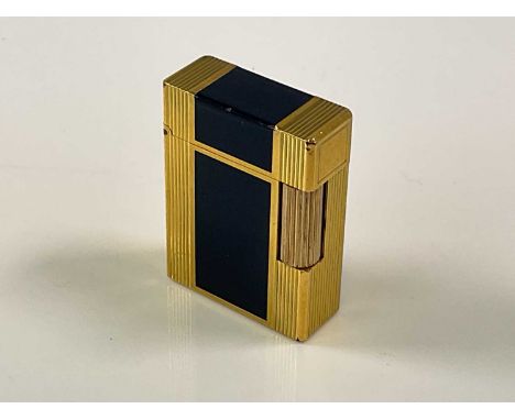 DUPONT; a vintage dark blue enamelled and brass lighter of rectangular form, height 47mm.