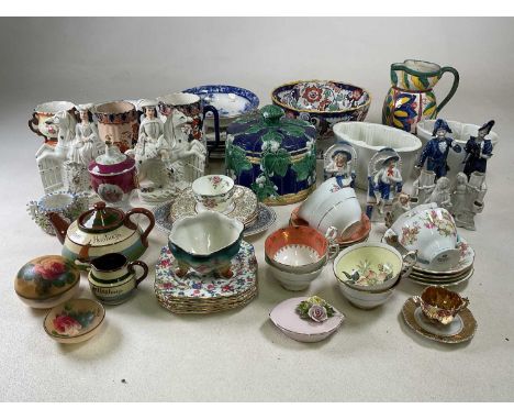 A quantity of 19th century and later decorative ceramics, including Staffordshire flatbacks, majolica cheese dome lid, jelly 