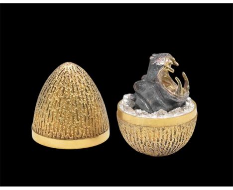 STUART DEVLIN; an Elizabeth II hallmarked silver gilt Easter egg, enclosing a hippopotamus with mouth wide open, no. 46, hall