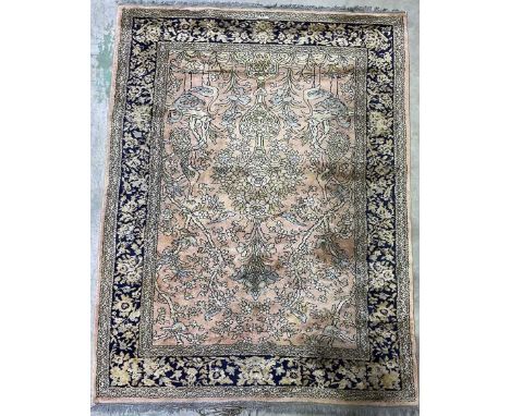 A Persian rug, with urn, floral and bird decorated central panel, 222 x 170cm.
