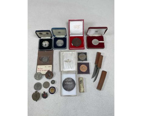 A group of coins, medals and medallions, including a silver medallion inscribed 'The Society for International Numismatics, H