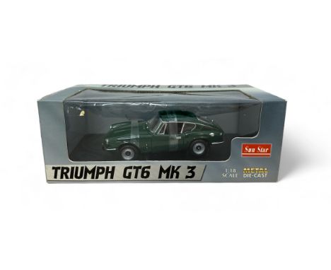 Sunstar 1/18th scale Triumph GT6 LHD green No. 1055, generally excellent in excellent to good plus window box and card outer 