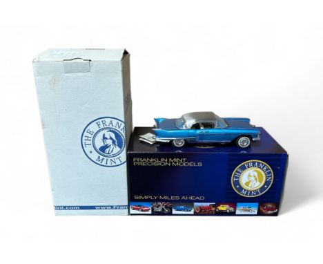 Franklin Mint 1/24th scale 1957 Cadillac Brougham metallic blue with silver roof No. K6-4832, generally excellent in excellen