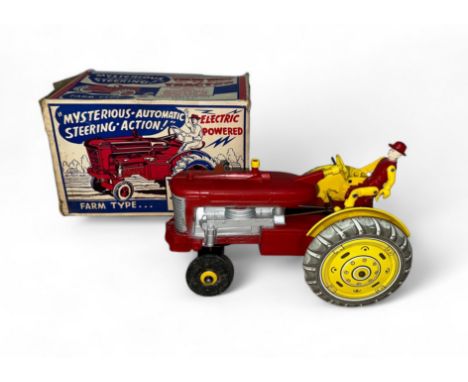 Louis Marx Tricky Tommy Tractor, battery-operated (untested), red with yellow tinplate hubs, red and yellow seated Farmer fig