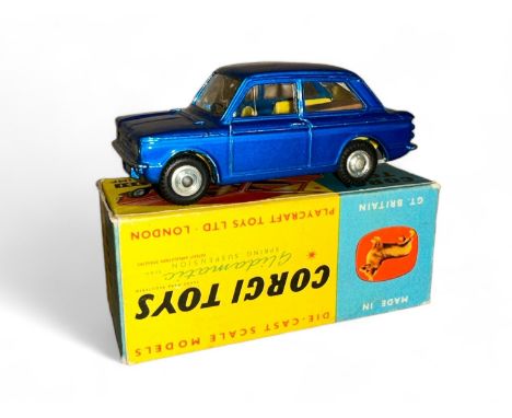 Corgi Hillman Imp No. 251, metallic blue, lemon interior, large tan suitcase and spun hubs, excellent in good plus box (ink 4