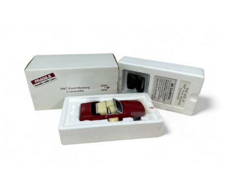 Danbury Mint 1/24th scale 1967 Ford Mustang convertible, dark red with cream interior and unattached black hood in plastic ca