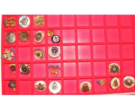 Selection of mother-of-pearl and enamel military badges 