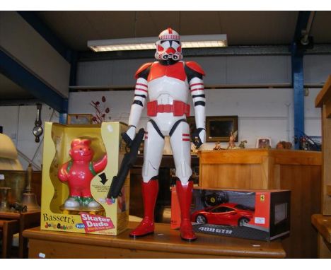 A vintage Bassett's Jelly Babies Skater Dude - in box, a Star Wars Storm Trooper - height 78cm and a Rastar Ferrari scale mod