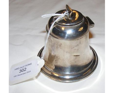 A silver capstan inkwell