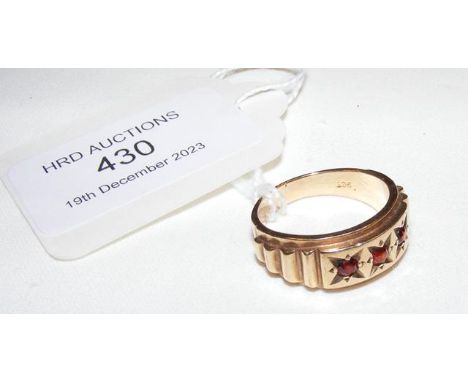 A 9ct gold ring with red stone mount