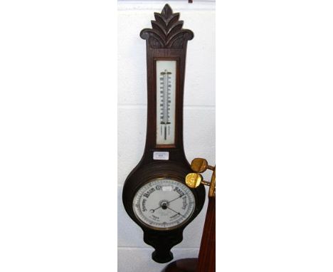A wall barometer and thermometer 