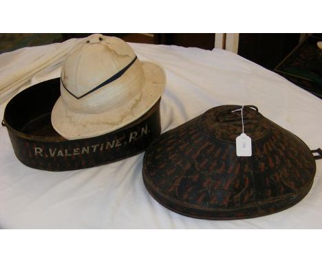 A Naval pith helmet - the original metal box inscribed 'R. Valentine R.N' 