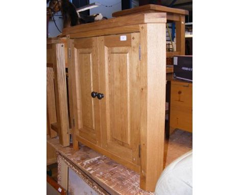 A contemporary light oak corner cupboard - width 80cm 