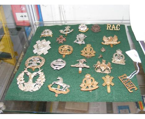 Collection of over 20 assorted military badges and insignia, including Royal Army Ordnance Corps, etc. 