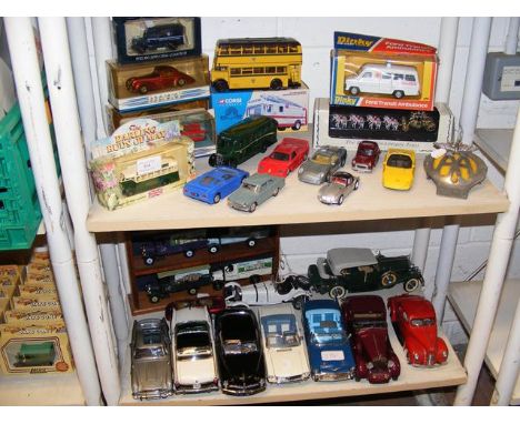 A quantity of die cast model vehicles, including Corgi, Dinky and Danbury Mint - on two shelves, together with AA badge 