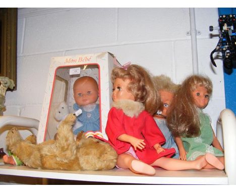 A vintage Fisher Price 'Cherry' cuddly first doll, together with other dolls and a vintage bear 