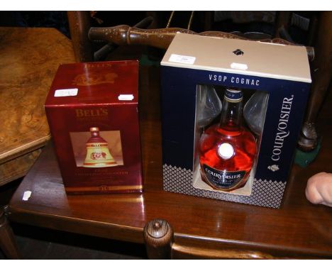 An unopened bottle of Courvoisier together with an unopened Bell's Scotch Whiskey decanter in box