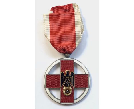 German Third Reich Red Cross Medal.  A good example. Within a narrow white circlet, a red translucent enamel Geneva Cross mou