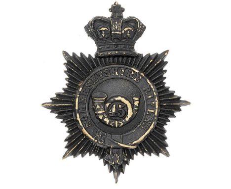 Somersetshire Rifles Victorian shako plate circa 1860-80.  Good scarce die-stamped blackened brass crowned star mounted with 