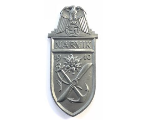 German Third Reich WW2 Army, Waffen SS and Luftwaffe issue Narvik Arm Shield.  A good die-stamped grey metal example. Eagle a