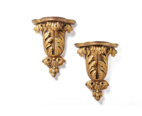 A PAIR OF CARVED GILTWOOD WALL BRACKETS
19th Century, the shaped shelf above scrolling acanthus
40cm high
Condition: For a co